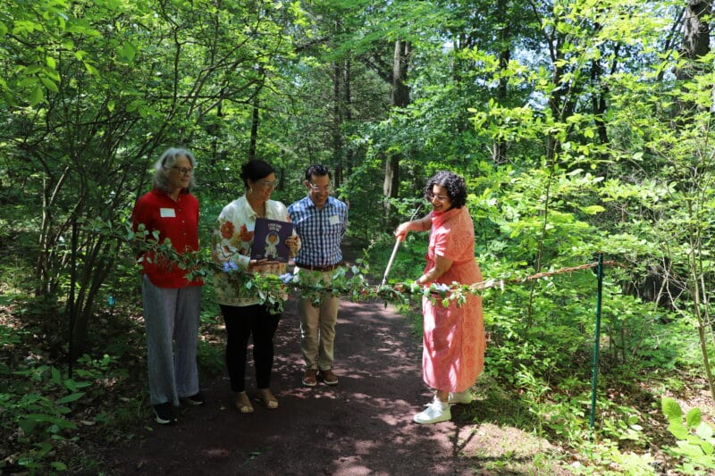 Ribbon cutting in a wooded trail