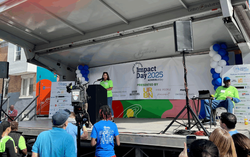 Woman speaking on a stage